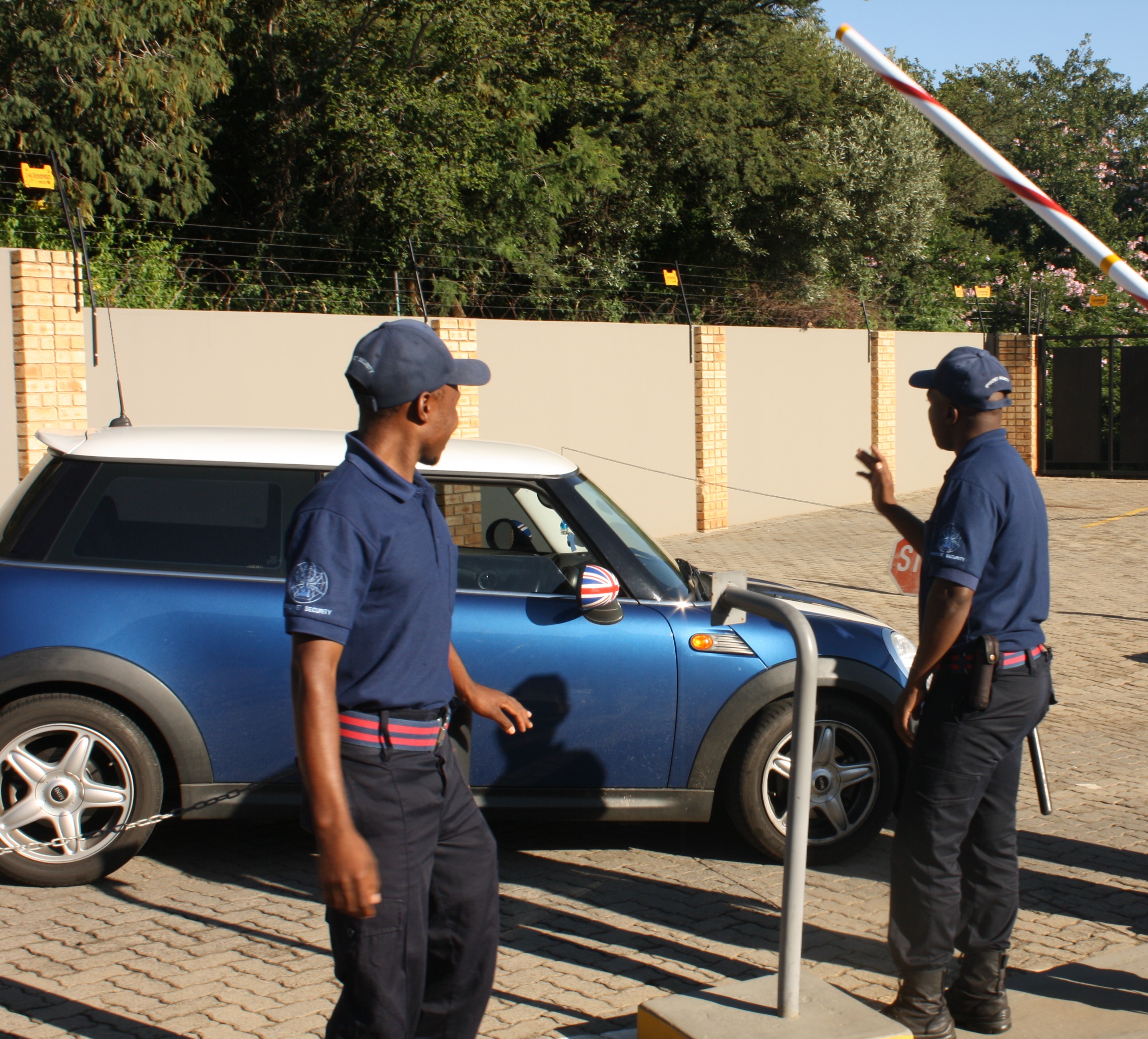 Guards ensuring clients drive out safely